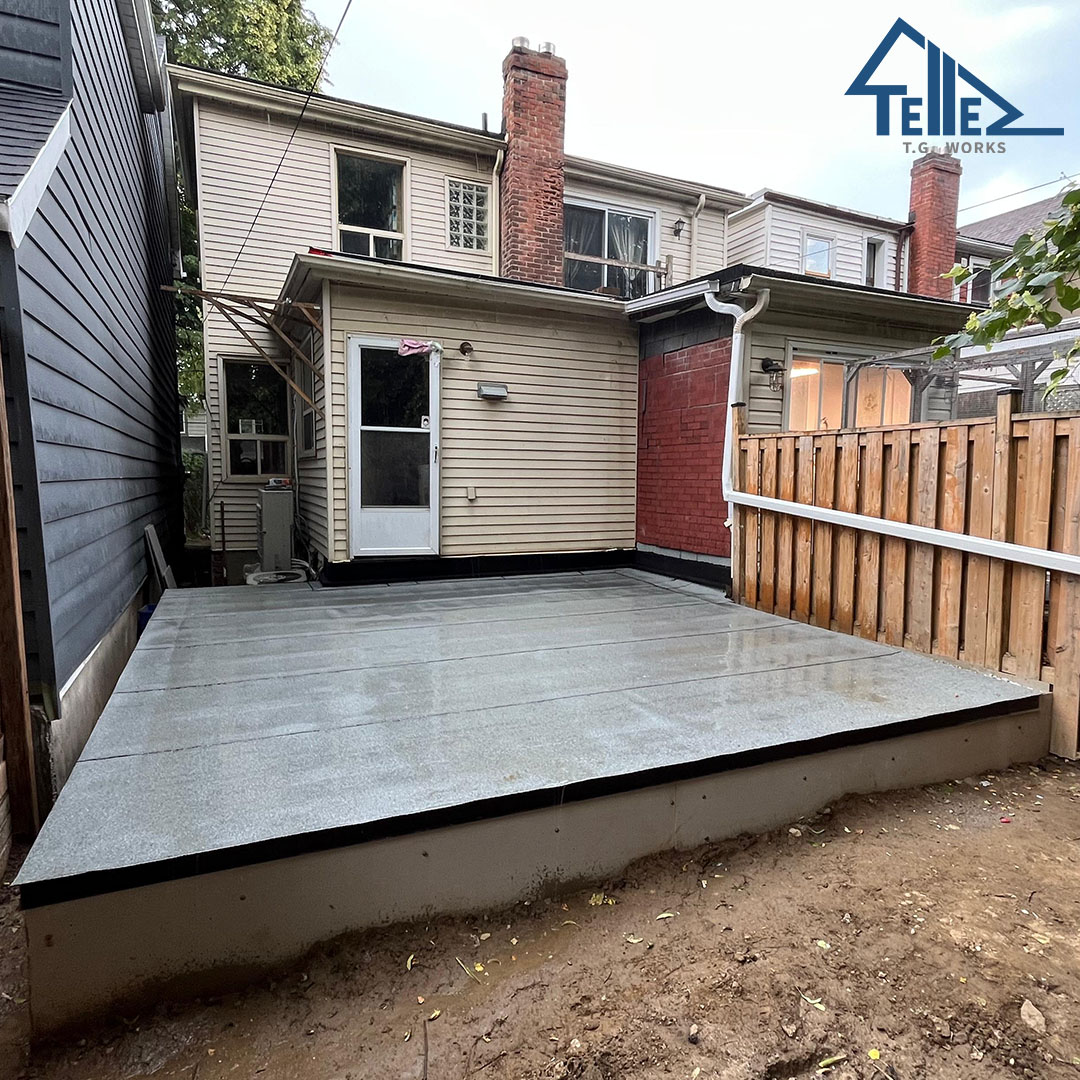 Finished concrete patio slab in Toronto backyard
