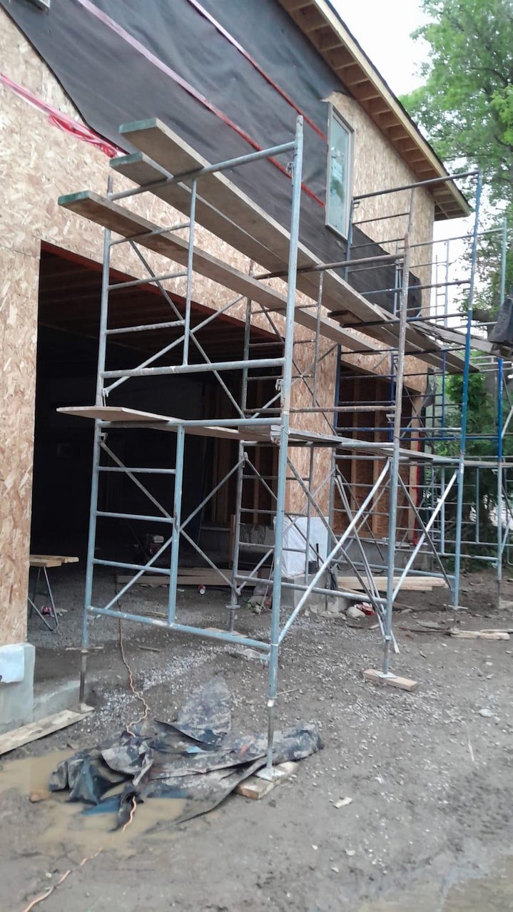 Exterior renovation with scaffolding on residential property in the GTA
