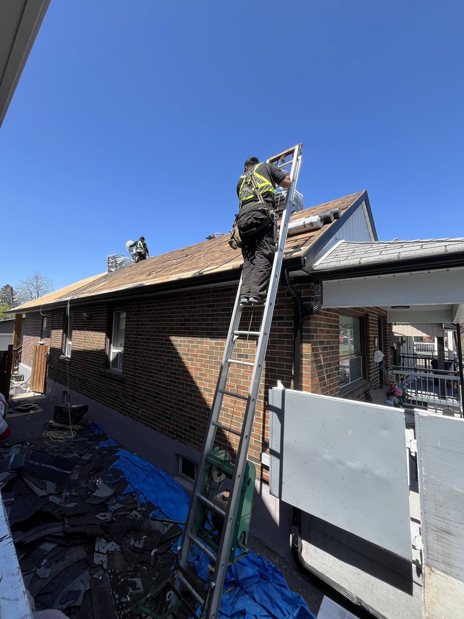 TG Works roofing crew installing new shingles on Toronto home