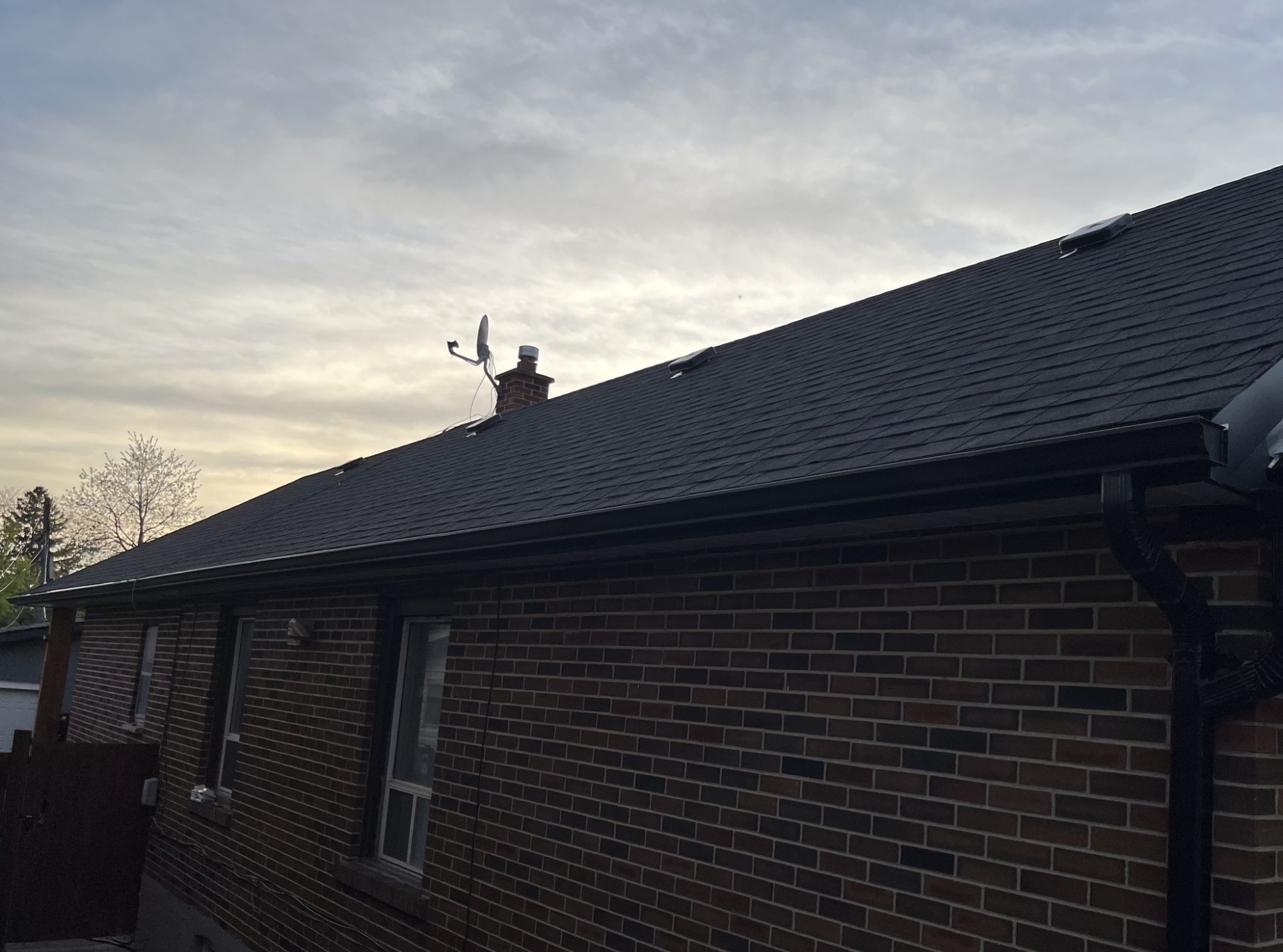 Completed shingle roof replacement on residential home in Toronto by TG Works