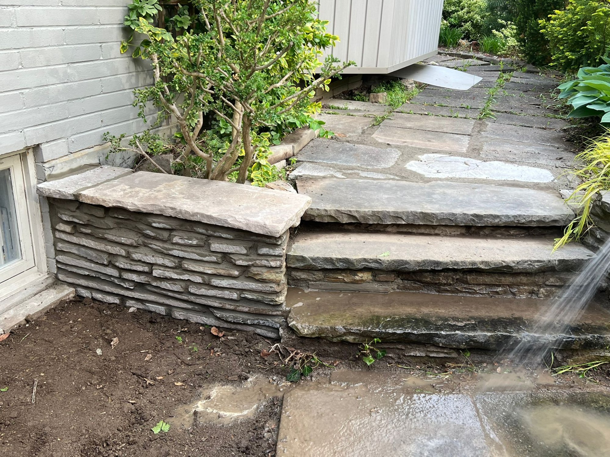Rebuilt stone steps and retaining wall by TG Works in Toronto